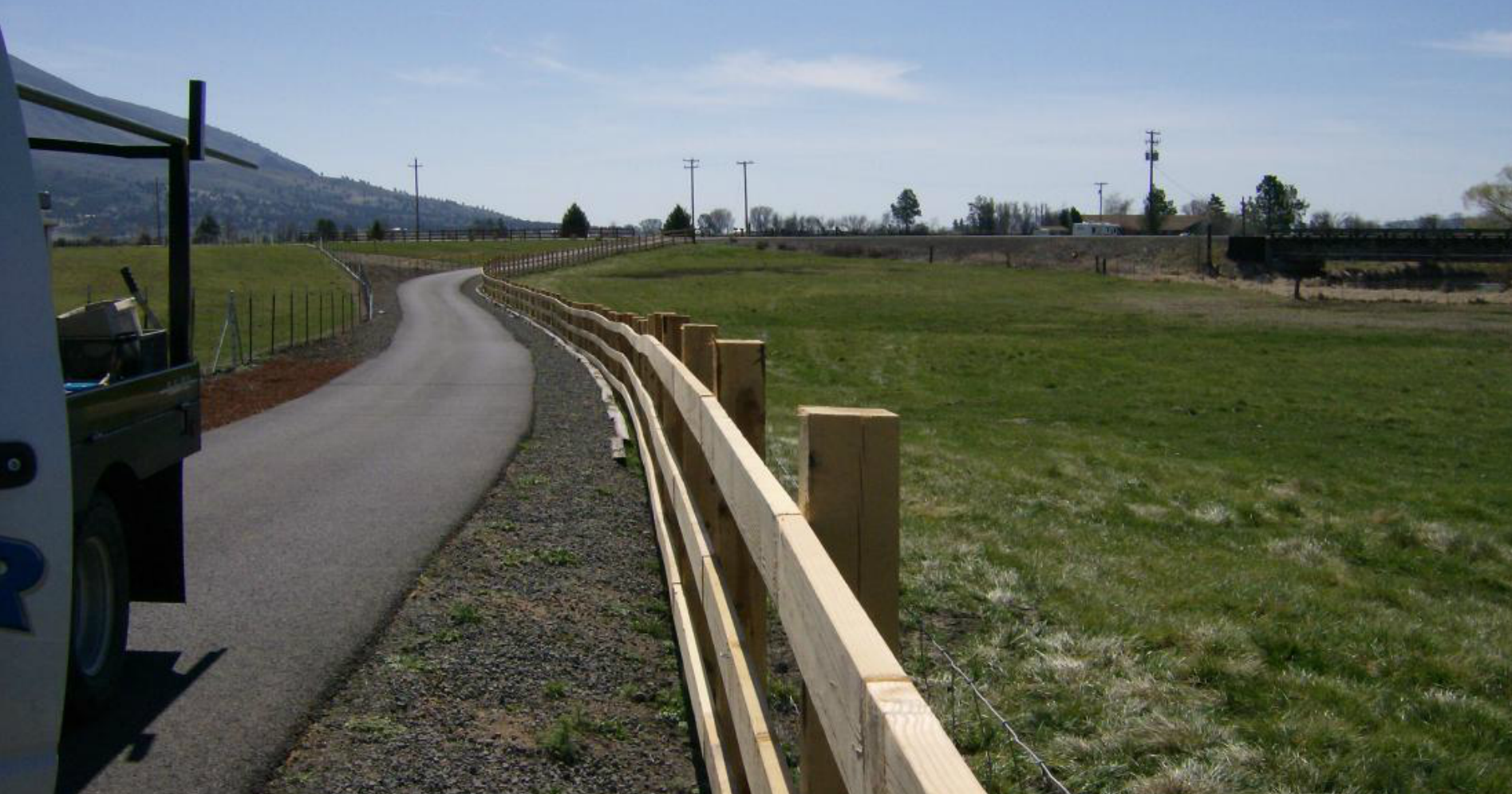 Wood rail fence along a rural driveway in Southern Oregon